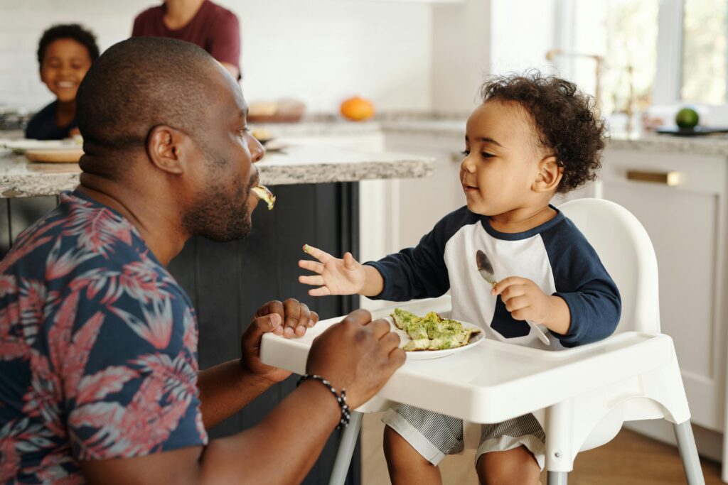 Meal Planning for Men Over 35: A 7-Days Challenge to Enhanced Health and Vitality 4 A men over 35 enjoying healthy meal with his children