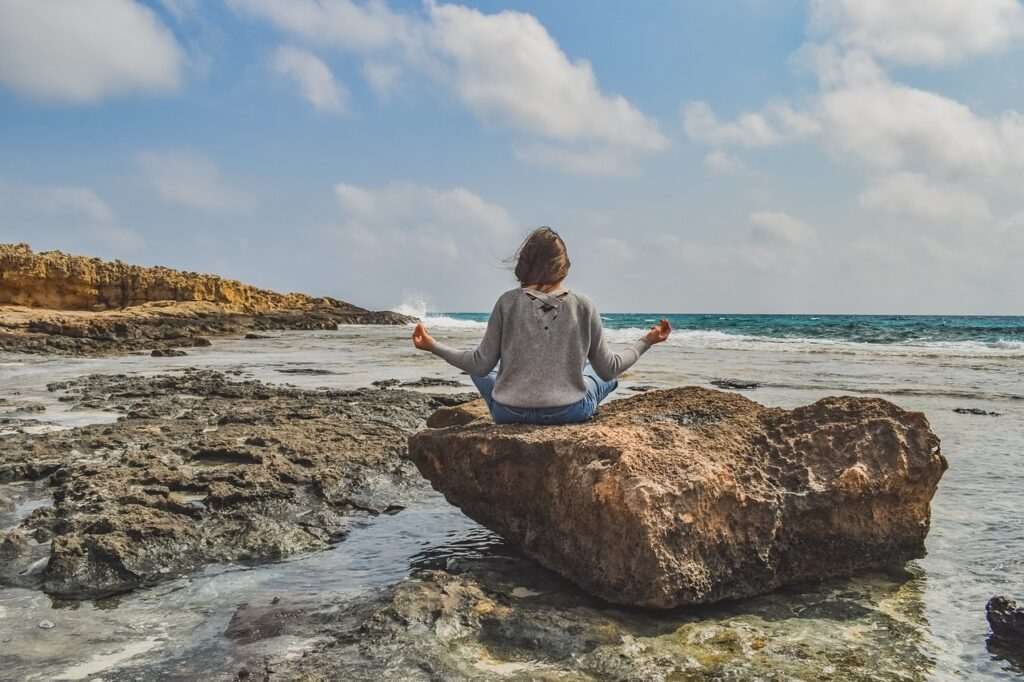 5 Mindfulness Practices for Daily Life: Discover The Secrets of Peaceful Lifestyle 2 mindfulness practice by a woman on a sea beach